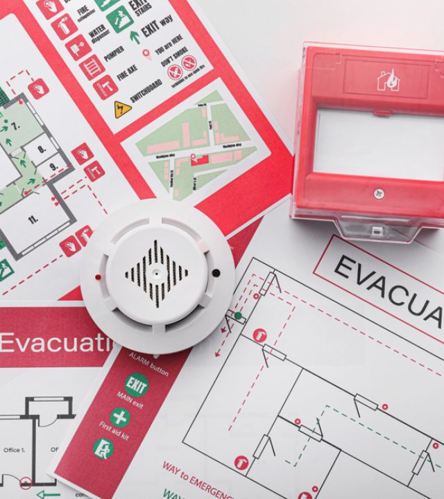 Evacuation,Plans,,Smoke,Detector,And,Manual,Call,Point,On,White